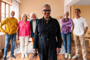 group of senior friends bonding at home for dinner party